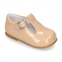 Classic little patent leather T-strap shoes in soft colors.