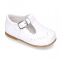 Classic little patent leather T-strap shoes in soft colors.