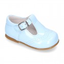 Classic little patent leather T-strap shoes in soft colors.