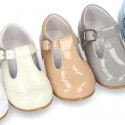 Classic little patent leather T-strap shoes in soft colors.