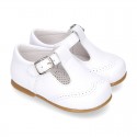 Classic little patent leather T-strap shoes in soft colors.