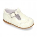 Classic little patent leather T-strap shoes in soft colors.