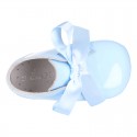 Patent leather little bootie for babies with silk ties closure design.