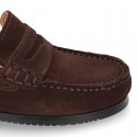 Suede leather Classic Moccasins for toddler boys with thick outsole and detail mask.