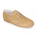 Laces up oxford shoes in suede leather for girls.