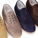 Laces up oxford shoes in suede leather for girls.