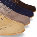 Laces up oxford shoes in suede leather for girls.