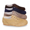 Laces up oxford shoes in suede leather for girls.