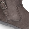Suede leather boot shoes with side buckle and fake hair neck design for girls.