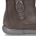 Suede leather boot shoes with side buckle and fake hair neck design for girls.