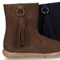 Suede leather boot shoes with side buckle with fringed design for girls.