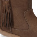 Suede leather boot shoes with side buckle with fringed design for girls.