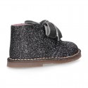 Classic GLITTER safari boots with velvet ties closure .