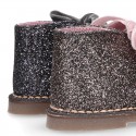 Classic GLITTER safari boots with velvet ties closure .