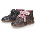 Classic GLITTER safari boots with velvet ties closure .