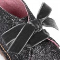 Classic GLITTER safari boots with velvet ties closure .