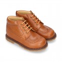 VINTAGE Nappa leather kids dress booties with shoelaces closure.