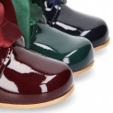 Classic patent leather ankle boots to dress with SILK ties closure for first steps.