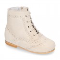 New girl Pascuala style boots in suede leather with perforated design.