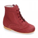 New girl Pascuala style boots in suede leather with perforated design.