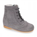 New girl Pascuala style boots in suede leather with perforated design.