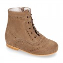 New girl Pascuala style boots in suede leather with perforated design.