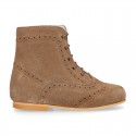 New girl Pascuala style boots in suede leather with perforated design.