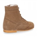 New girl Pascuala style boots in suede leather with perforated design.