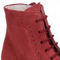 New girl Pascuala style boots in suede leather with perforated design.