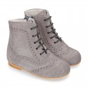 New girl Pascuala style boots in suede leather with perforated design.