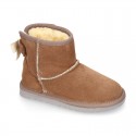 Suede leather Australian style Boot shoes with RIBBON design and fake hair lining.