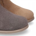 Suede leather little ankle boots with fake hair neck design.