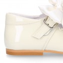 Classic sweet patent leather little Mary Janes with scallop and buckle with BOW design.