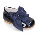 Classic patent leather little Mary Janes with scallop and buckle with BOW design.