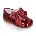 Classic patent leather little Mary Janes with scallop and buckle with BOW design.