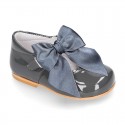 Classic patent leather little Mary Janes with scallop and buckle with BOW design.