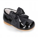 Classic patent leather little Mary Janes with scallop and buckle with BOW design.