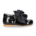 Classic patent leather little Mary Janes with scallop and buckle with BOW design.