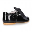 Classic patent leather little Mary Janes with scallop and buckle with BOW design.