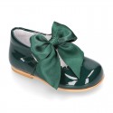 Classic patent leather little Mary Janes with scallop and buckle with BOW design.