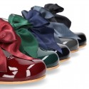 Classic patent leather little Mary Janes with scallop and buckle with BOW design.