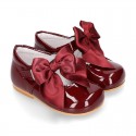 Classic patent leather little Mary Janes with scallop and buckle with BOW design.