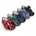 Classic patent leather little Mary Janes with scallop and buckle with BOW design.