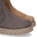 Suede leather boots with fake hair neck design and thick soles.