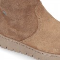 Suede leather boots with fake hair neck design and thick soles.