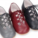 Nappa leather Stylized classic english style shoes with shoelaces closure.