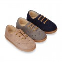 Suede leather kids Laces up style shoes with perforated design.