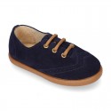 Suede leather kids Laces up style shoes with perforated design.
