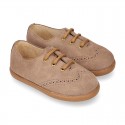 Suede leather kids Laces up style shoes with perforated design.