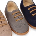 Suede leather kids Laces up style shoes with perforated design.